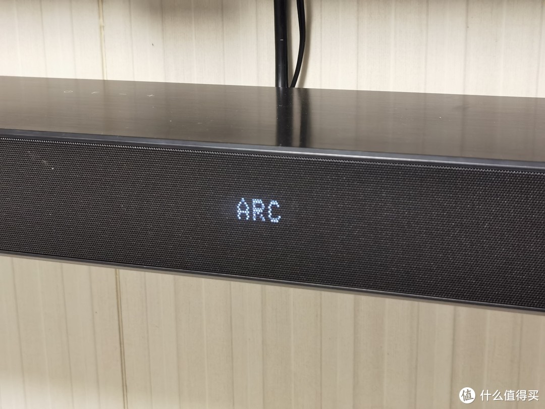 用遥控器选择OPI ARC，链接成功电视会有提示是否使用ARC声音。